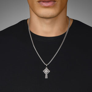 a man in a black shirt wears a celtic sterling silver cross pendant