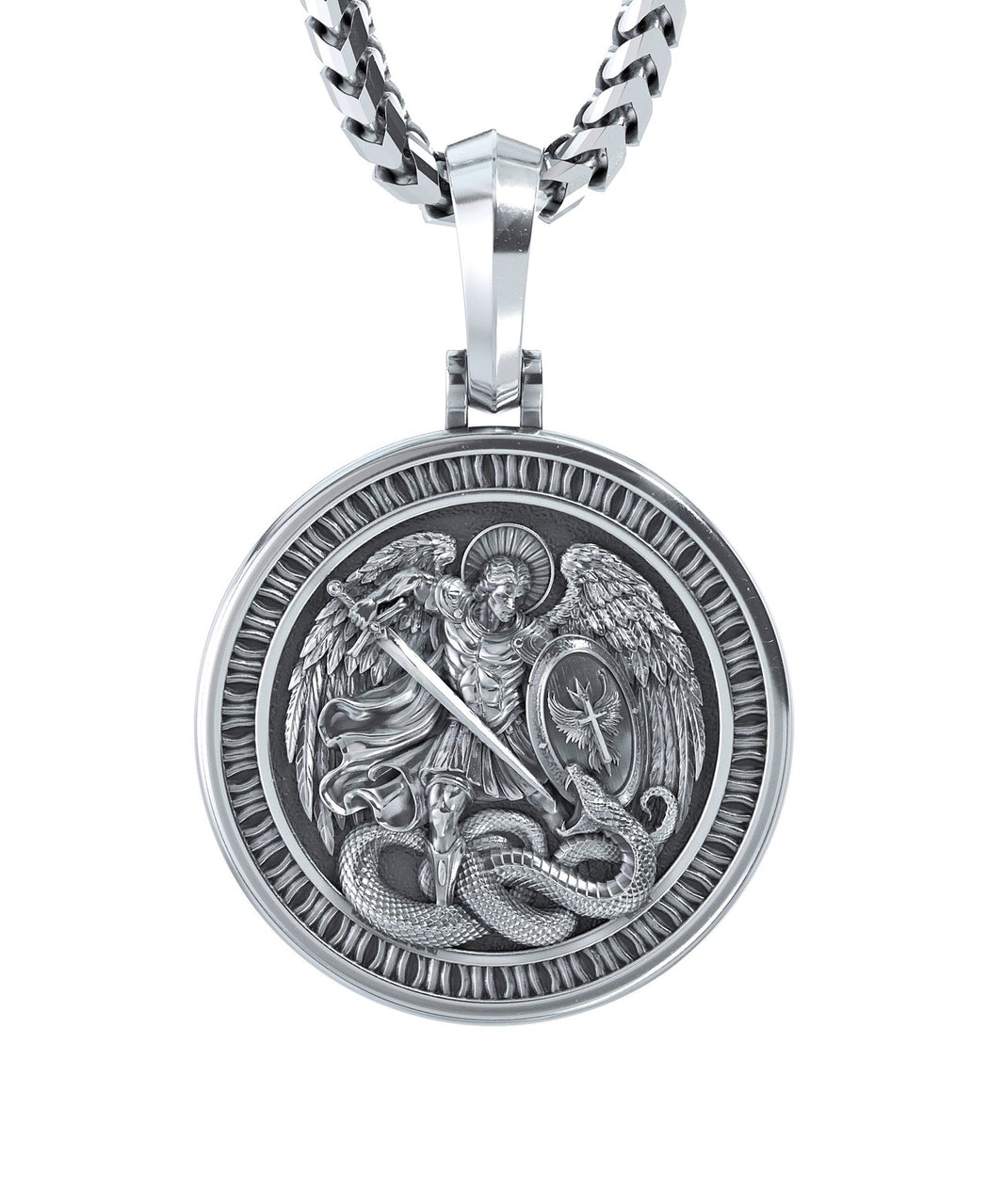 The sterling silver Champion Saint Michael pendant on a chain: St. Michael with wings spread, a sword raised and a shield, standing over the serpent