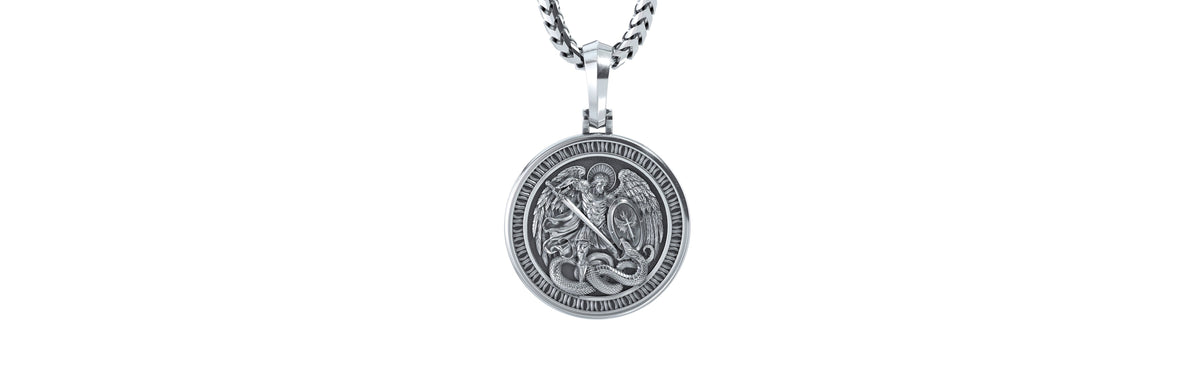 The sterling silver Champion Saint Michael pendant on a chain: St. Michael with wings spread, a sword raised and a shield, standing over the serpent