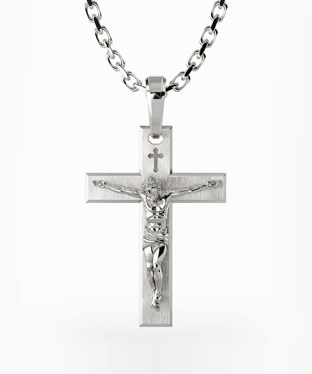 The sterling silver Redemption crucifix pendant on a chain, a figure of Christ on a brushed cross with a small cross above His head