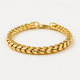 6.5mm Diamond Cut Franco Bracelet, 18k Yellow Gold lays on a white surface