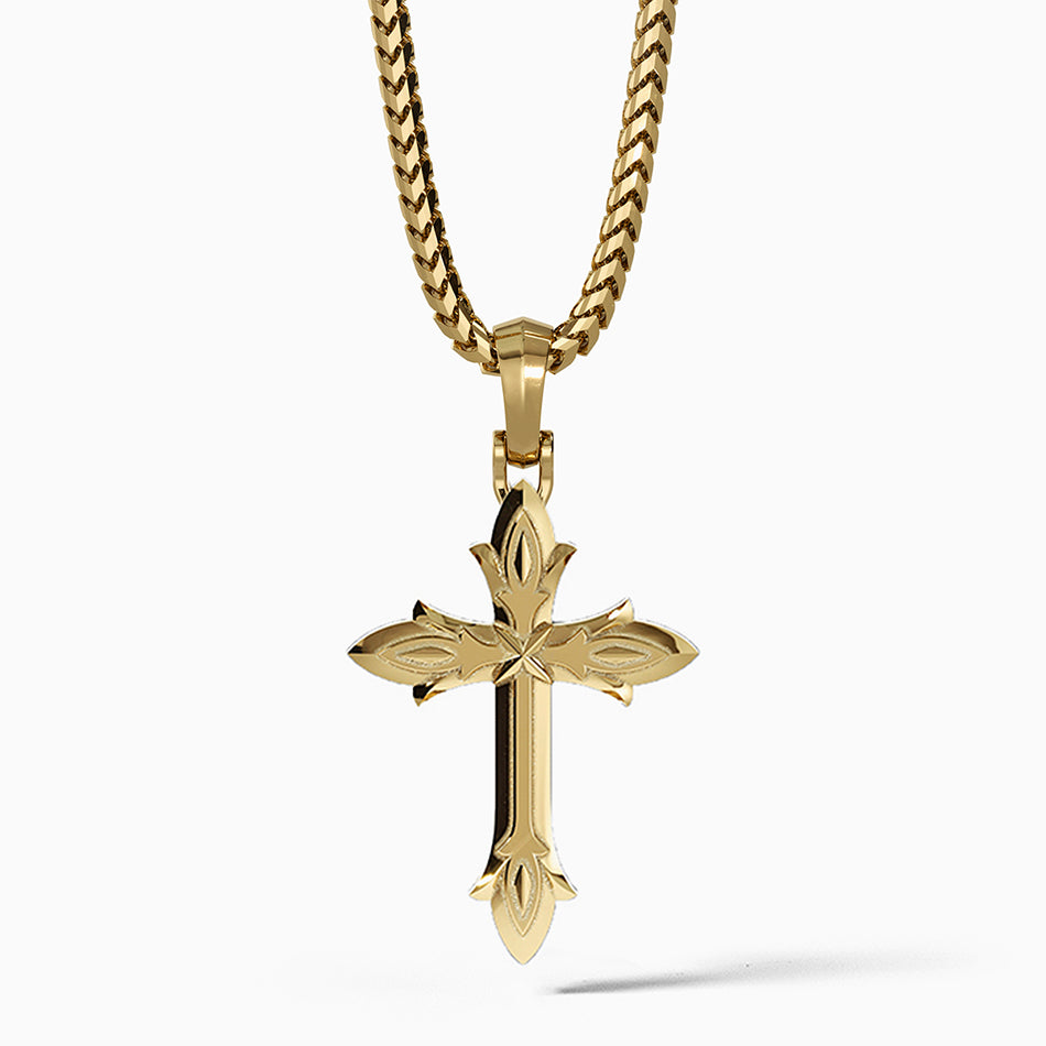 a mens gold cross necklace hangs from a 14 karat chain