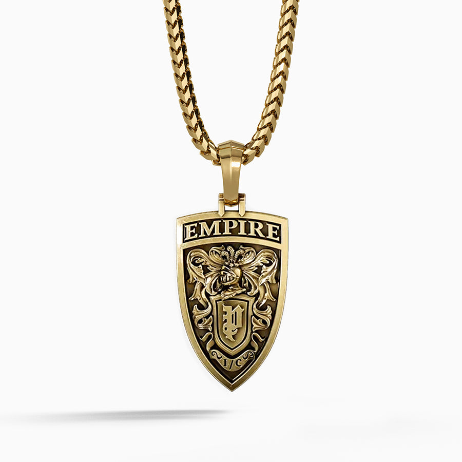 The back of a gold lion pendant features a crest with a knight's helmet and swords
