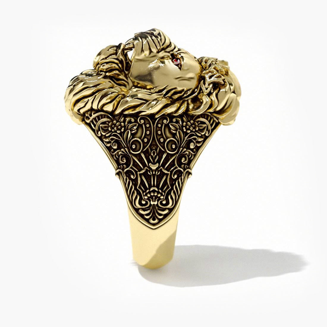 a solid gold lion ring stands up with its ruby eyes gleaming