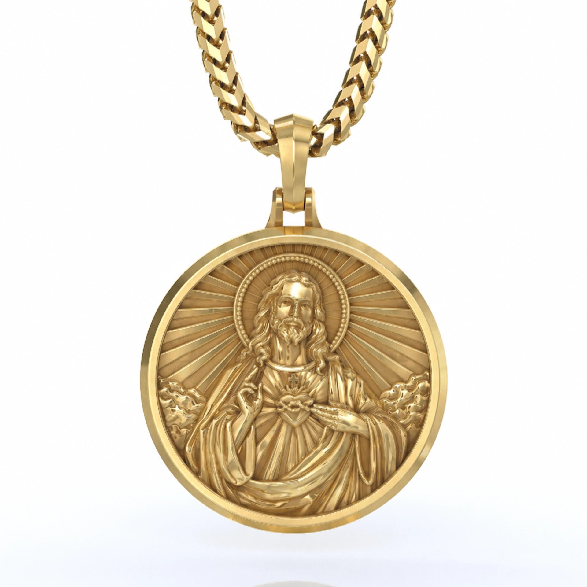 a round sacred heart of Jesus gold pendant necklace on a white background