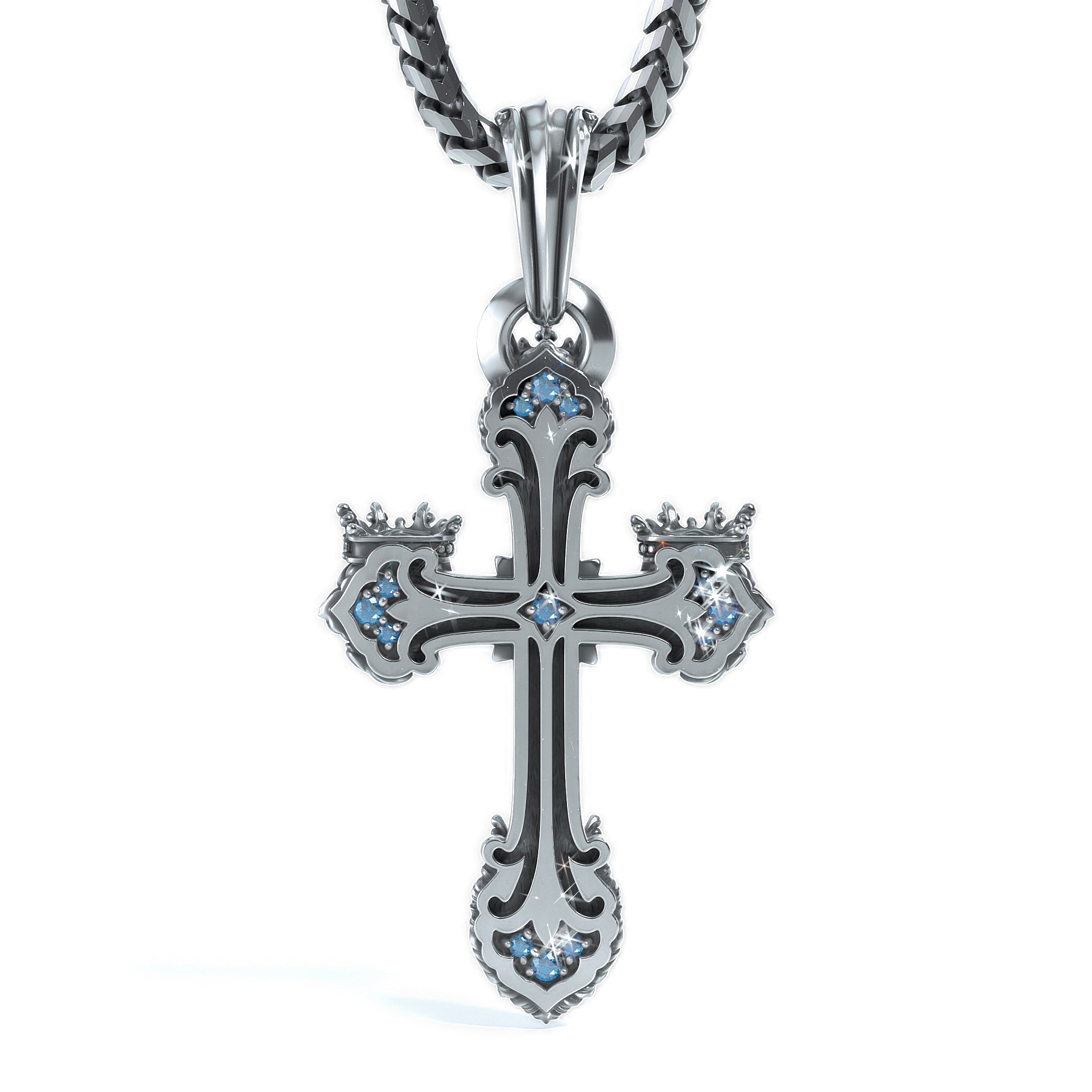 A gothic-style cross pendant necklace in silver-toned metal with black oxidized detailing and small light blue gemstone accents, suspended from a matching silver chain on a white background.