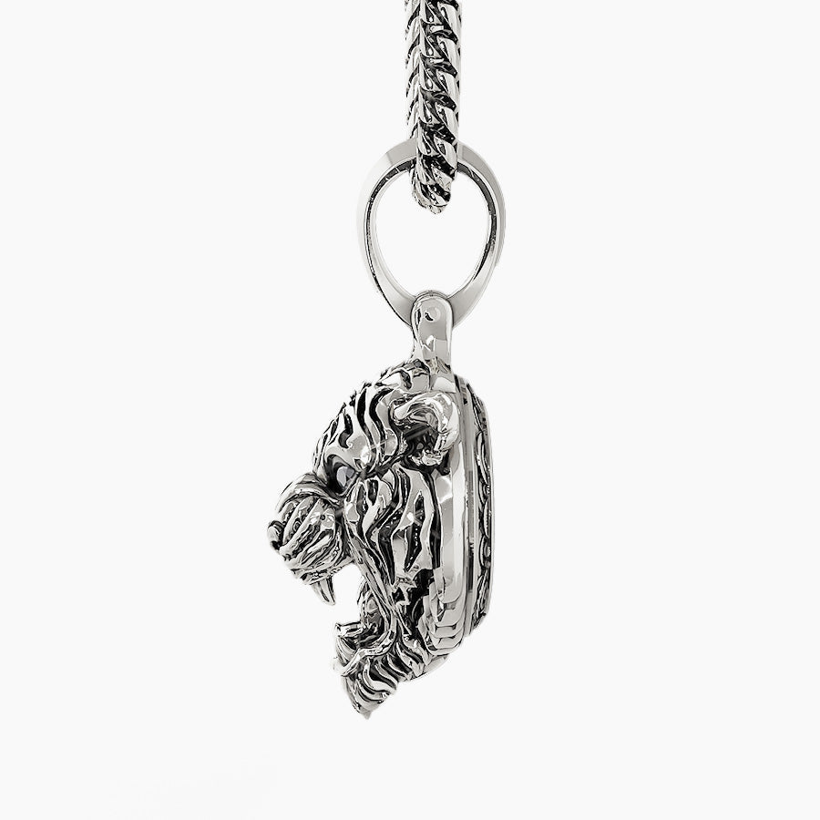 Side view of a sculpted white gold Tiger pendant by Proclamation Jewelry