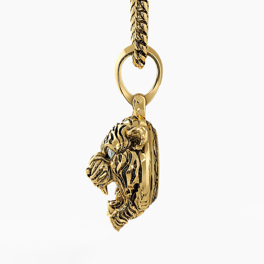 the side profile of a three dimensional gold tiger pendant