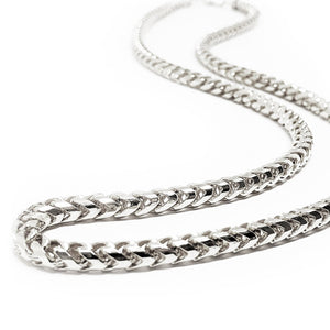 a white gold diamond cut franco chain necklace laying close to see the shining facets