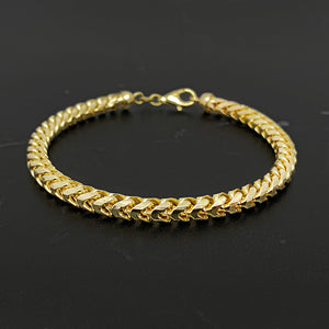 closeup of a 14 karat yellow gold 5mm diamond cut franco bracelet