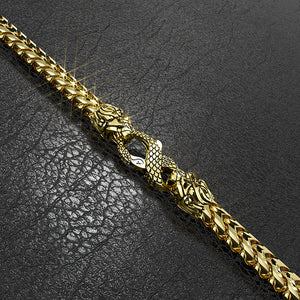 a gold franco bracelet with the lion and snake clasp by Proclamation Jewelry