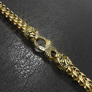 a gold franco bracelet with the lion and snake clasp by Proclamation Jewelry