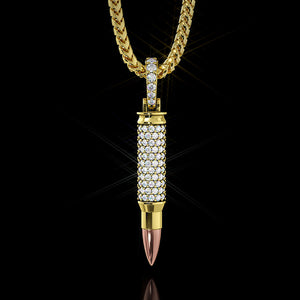 A diamond bullet pendants dazzles with lights as it hangs from a gold chain
