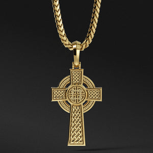 a mens Celtic gold cross necklace with weaving patterns hangs from a chain