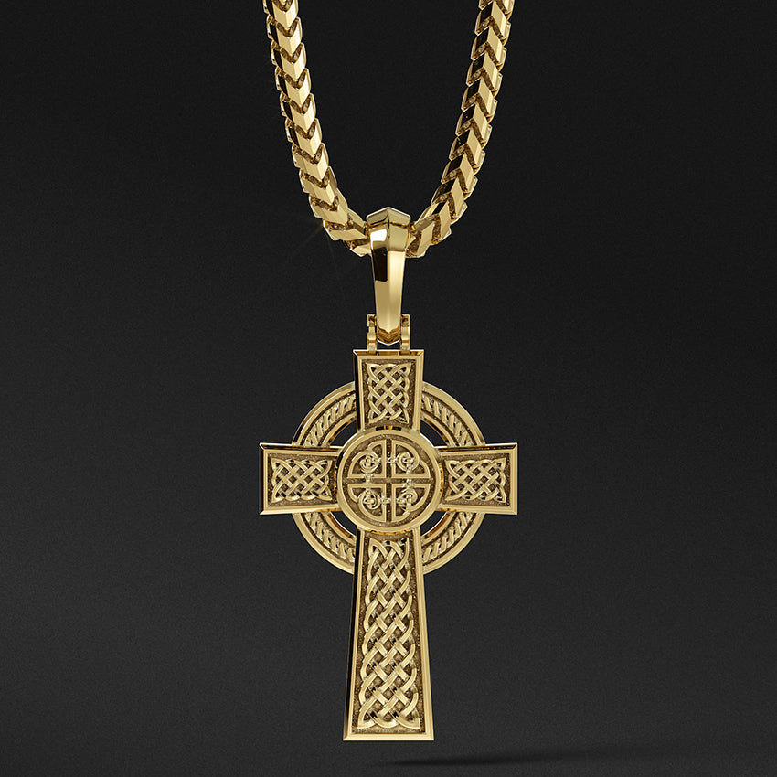 a mens Celtic gold cross necklace with weaving patterns hangs from a chain