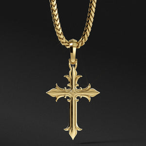 a mens gold cross necklace hangs from a chain