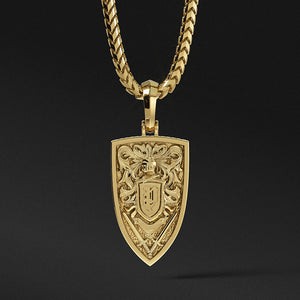 The back of a gold lion pendant features a crest with a knight's helmet and swords