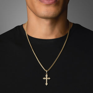 a man in a black shirt wears a gold cross pendant