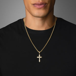 a man in a black shirt wears a gold cross pendant