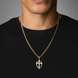 a man in a black shirt wears a powerful gold cross pendant