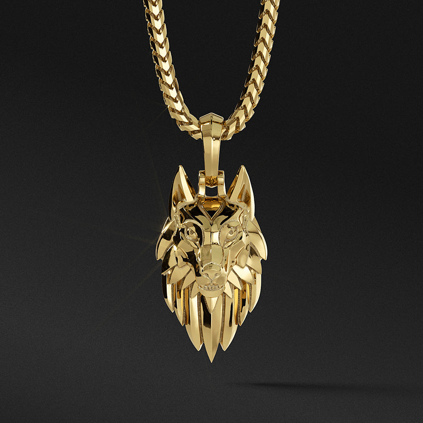 a sleek gold wolf pendant hangs from a franco chain