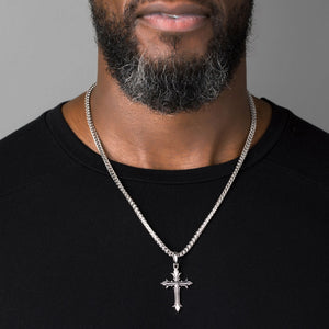 man wears a large silver cross necklace men's chain