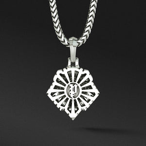 The back of a silver lion pendant features a sunburst pattern and the Proclamation Jewelry logo