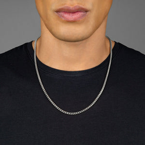 a man in a black t shirt wearing a 3mm diamond cut franco white gold necklace for men